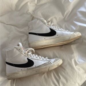 Nike White High-Top Sneakers with Black Swoosh